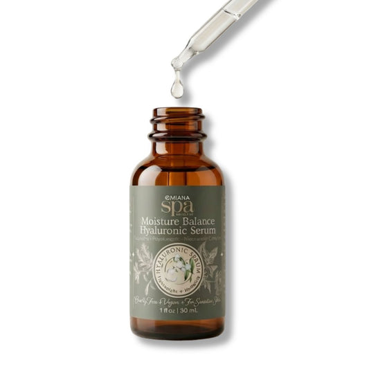 Brown bottle of Omiana Spa Moisture Balance Hyaluronic Serum with dropper on white background